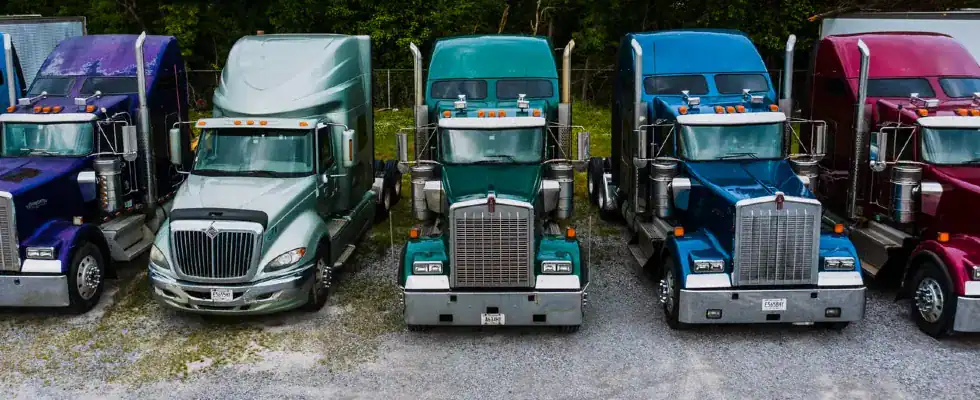 A row of colorful semi trucks