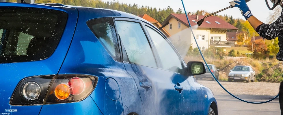 Automobile prressure washing using a pressure washer.