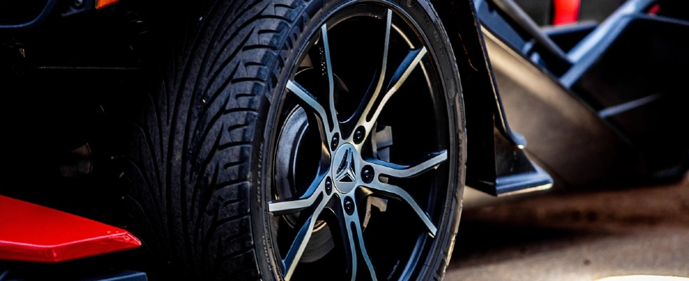 A close-up photo of a car wheel.