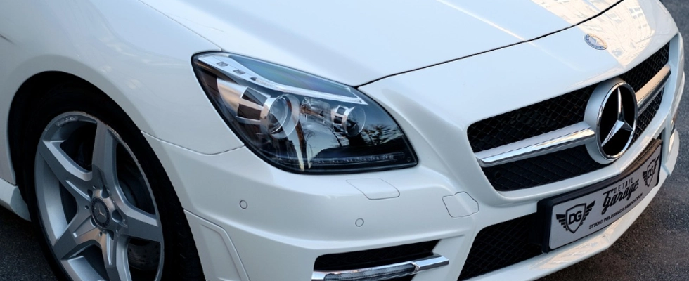 A car freshly painted in sleek white.