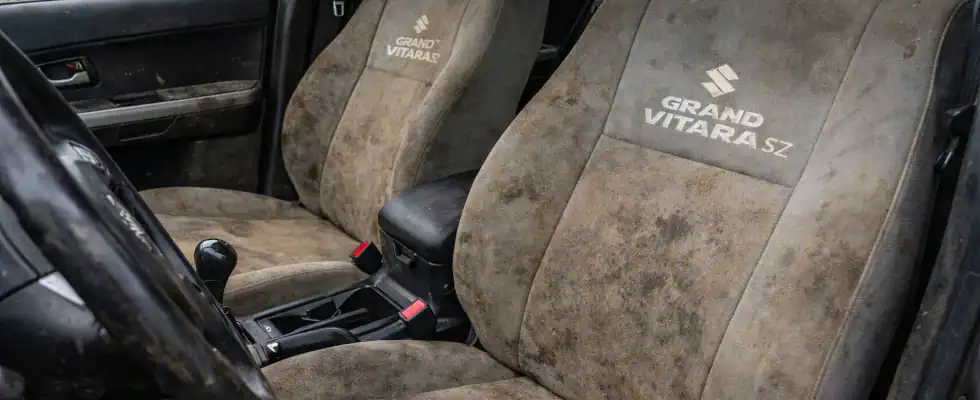 Dirty car seats with grand vitara logo