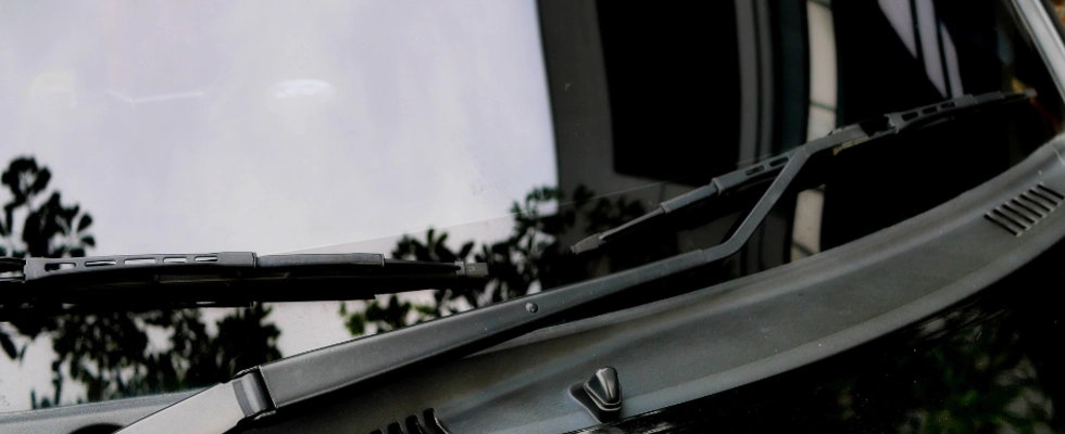 vehicle with windshield wipers made from rubber blades